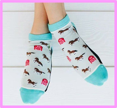 Hands holding soft patterned ankle socks