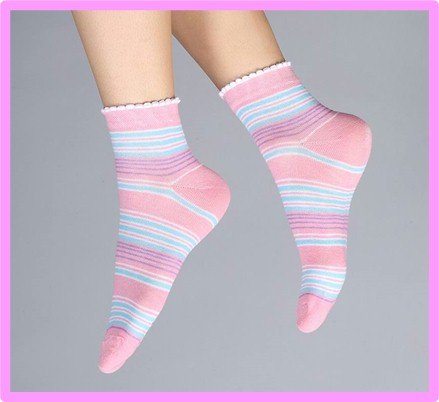 Hands holding cute patterned ankle socks